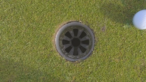 Top down shot of golf ball being putted Stock Footage 104564053