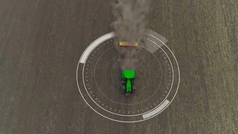 Top down shot of green autopilot tractor cultivating or seeding in field Stock Footage 167554349