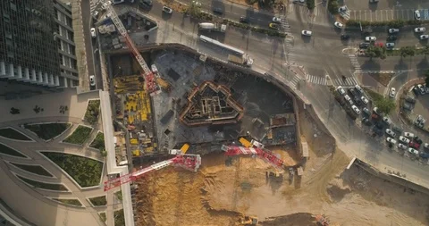Top Down shot of Huge cranes at construction site very high buildings Video stock 97180806