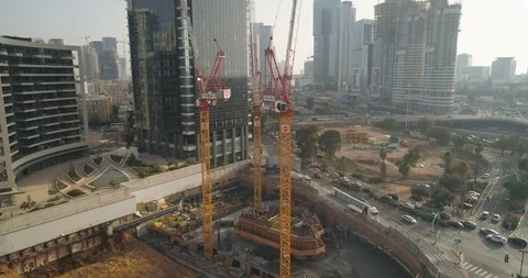 Top Down shot of Huge cranes at construction site very high buildings Video stock 97180845