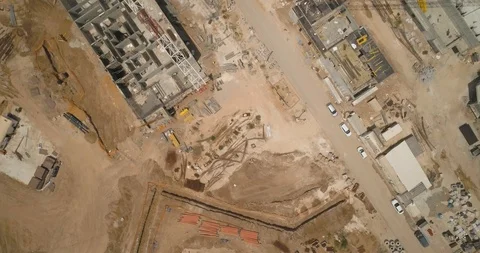 Top Down shot of Huge cranes at construction site very high buildings Video stock 97182631