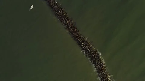 Top down shot of a jetty off a beach in the south. Stock Footage 140341784