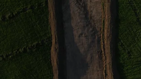 Top-down shot of a make shift dirt bridge at a construction site for Stock Footage 248406440
