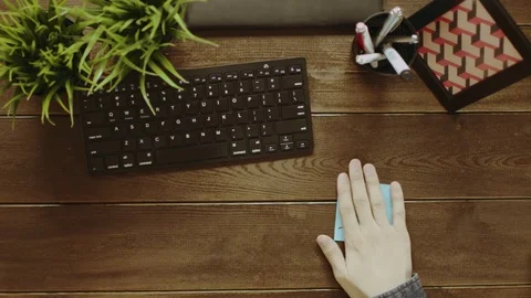 Top down shot of man trying to motivate himself by sticking notes with words "Do Stock Footage 81185160