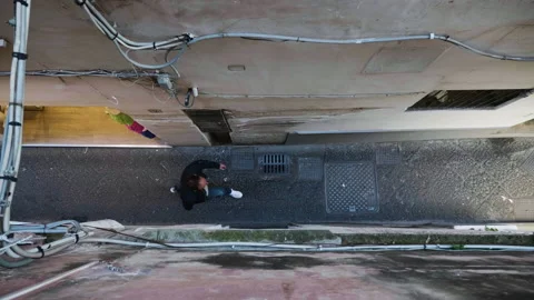 Top down shot of man walking through alley-way in Capri, Italy 4k Stock Footage 235591848