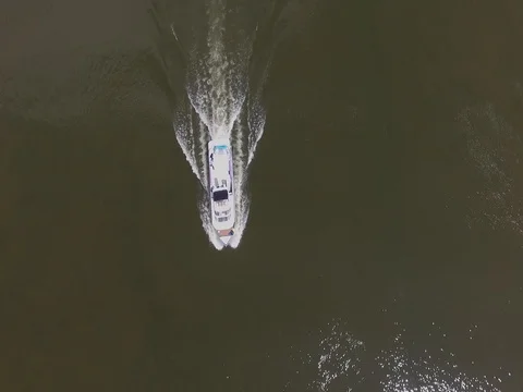 Top Down Shot of a Passing Boat Stock Footage 75792753