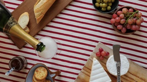 Top Down Shot Of A Picnic Table, With Champagne Being Poured Stock Footage 87054912