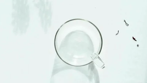 Top down shot pouring fresh red hibiscus tea into a glass cup Stock-Footage 334572509