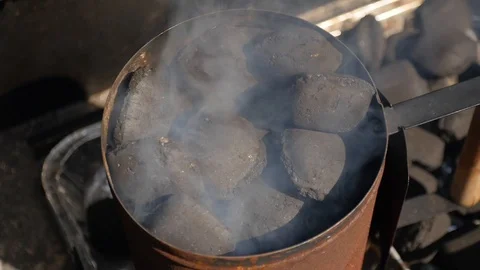 Top down shot of a smoking BBQ chimney in slow motion Stock-Footage 115054440