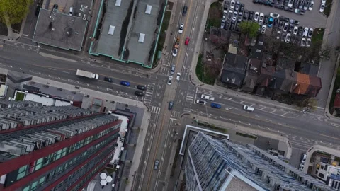 Top down shot of urban traffic at busy downtown area intersection with cars, ped Stock Footage 334695802