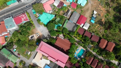 Top-down shot of various buildings and colored roofs of local residents' houses Stock Footage 247251699