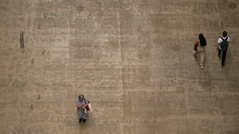 Top down shot of visitors walking on concrete floor at Tate Modern. London, UK. Stock Footage 204098927