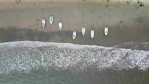 Top down shot of wild tropical beach with boats, waves and white sand. Stock Footage 285371039
