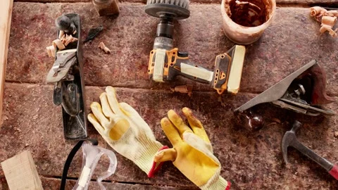 Top-down shot of woodworking tools on workbench in African workshop Stock Footage 346734019