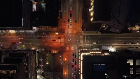 Top down showing downtown Toronto's glowing intersection at night, cars moving t Stock Footage 335226200
