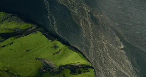 Top Down Slider over Moss Slopes and Black Sand at Base of Maelifell, Iceland 動画素材 348697712