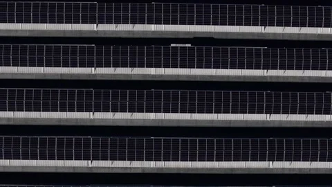 Top-down slow drone forward flyover above rooftop photovoltaic arrays in the Po Stock Footage 342292093
