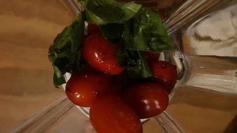 Top down, slow motion shot of a tomato sauce being made in a blender Stock-Footage 122212400