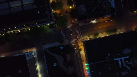 Top down spinning shot above intersection in dark American city at night. Stock Footage 263411474