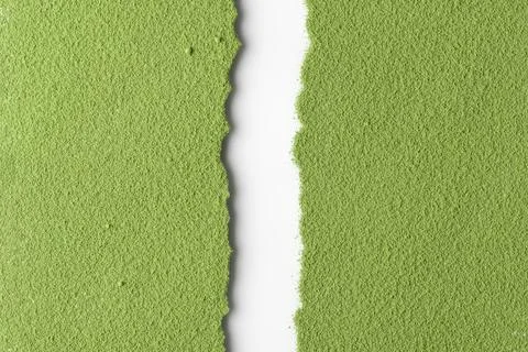 Top-down split of bright green matcha powder and white negative space, textur Stock Photos