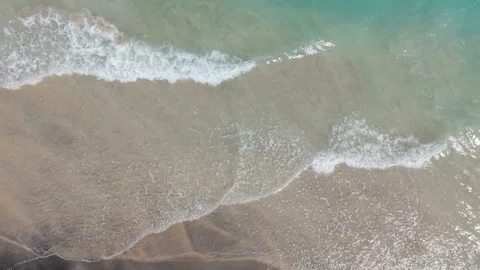 Top Down Static Aerial Drone View of Turquoise Ocean Waves and Sea Foam Stock Footage 346797693