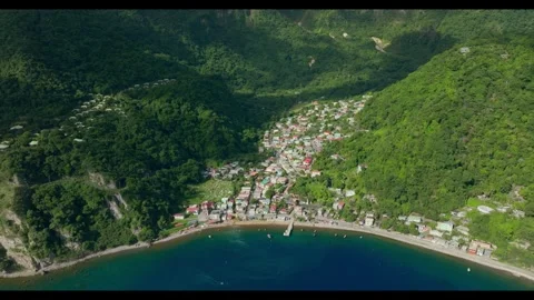 Top down Static aerial shot of the entire village of Soufriere and ocean Stock Footage 283394641