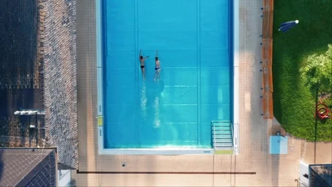 Top down static drone shot of 2 swimmers... | Stock Video | Pond5