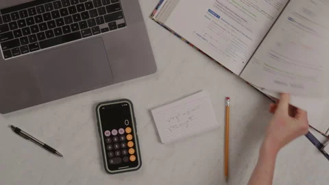 Top Down of Student Studying for Math Test Using Index Cards Next to Laptop Stock Footage 217770029