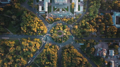 Top down time-lapse aerial footage of a park with a roundabout intersection, 8K Stock Footage 276377247