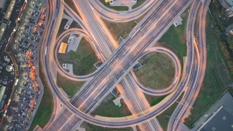 Top-down time-lapse, camera moves up and rotates over fast-moving cars Stock Footage 277081358