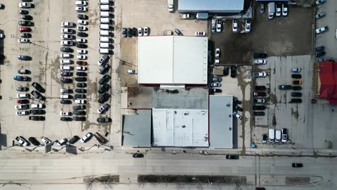 Top down timelapse aerial view of warehouse in small town Stock Footage 333525018