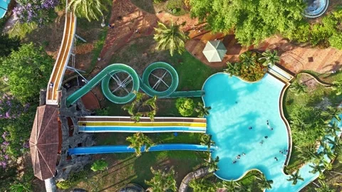Top-down timelapse of busy water slides at Dak Lak water park 스톡 동영상 337047069