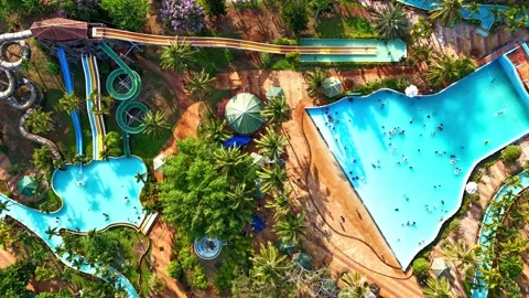 Top-down timelapse of crowded water park in Dak Lak during summer 動画素材 337047057