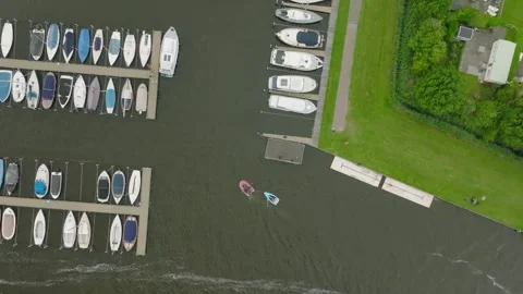 A top-down tracking drone shot of a harbor Stock Footage 314665421