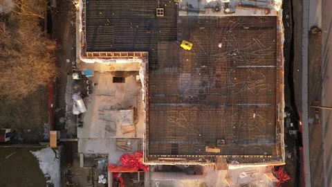 Top Down Tracking Drone Shot Over Building Construction Site Vídeos de archivo 328848541