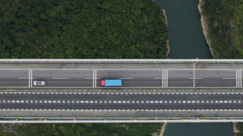 Top Down Tracking Highway Suspension Bridge Traffic 4K HLG Stock Footage 345619979