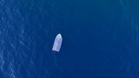 Top-Down Tracking a Powerboat on the Deep Blue Sea 4K Stock Footage 315629660