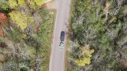 Top Down Tracking of Van with trailer through Fall Colored Forest in Wisconsin 스톡 동영상 165895342
