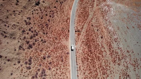 Top down tracking of a white SUV on a narrow Tibetan road Video stock 345884857