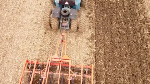 Top down of tractor plowing Stock Footage 266191315
