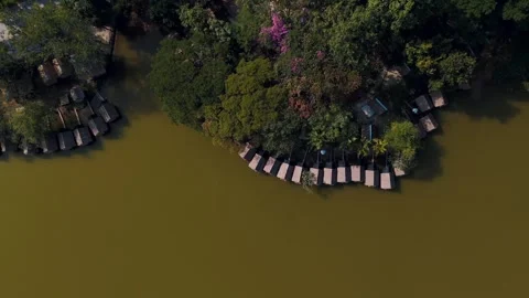 Top Down Traditional bamboo huts on Huay Tueng Thao Reservoir Chiang Mai Th.. Stock Footage 331476164