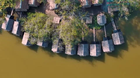 Top Down Traditional bamboo huts on Huay Tueng Thao Reservoir Chiang Mai Th.. Stock Footage 331476165