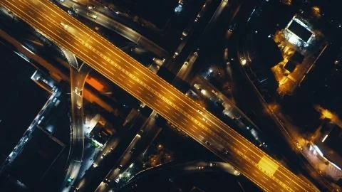 Top down of traffic road lit by lanterns at night illuminate aerial view Fotos Stock
