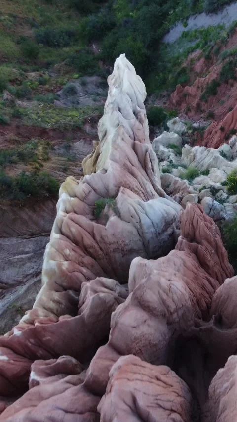 Top down of unique chalky white spire and sharp red clay pinnacles in Kazakhstan Видео 338129148
