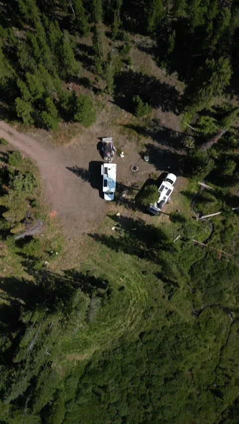 Top down vertical aerial of RVs camping in pine trees Sawtooth National Forest Stock Footage 280207516