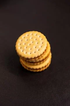 A top down vertical closeup of delicious round cookies with holes stacked o.. Stock Photos