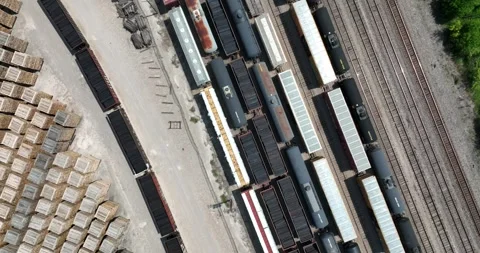 Top down vertical view of trains with cars loaded with railroad ties Stock-Footage 335669803