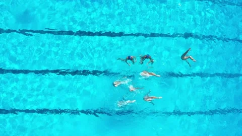 Top down video of swimming pool centre with a synchronized swimming team Stock Footage 179331755