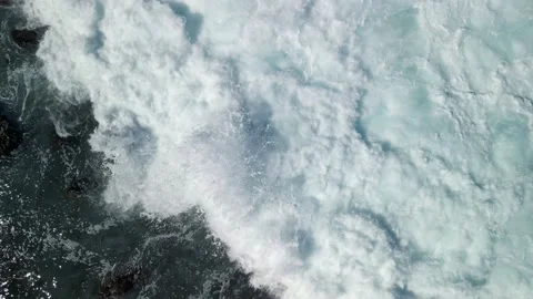 Top down view 4k video aerial slow motion waves on rocks in reunion island Stock Footage 174861434