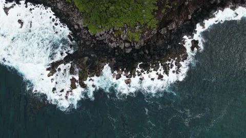 Top down view 4k video aerial waves on volcano rocks in reunion island Stock Footage 174861552